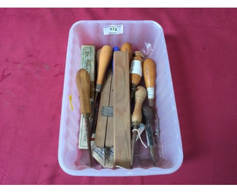 A quantity of rug making tools
