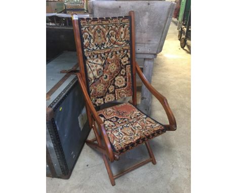 An Edwardian carpet upholstered folding salon chair