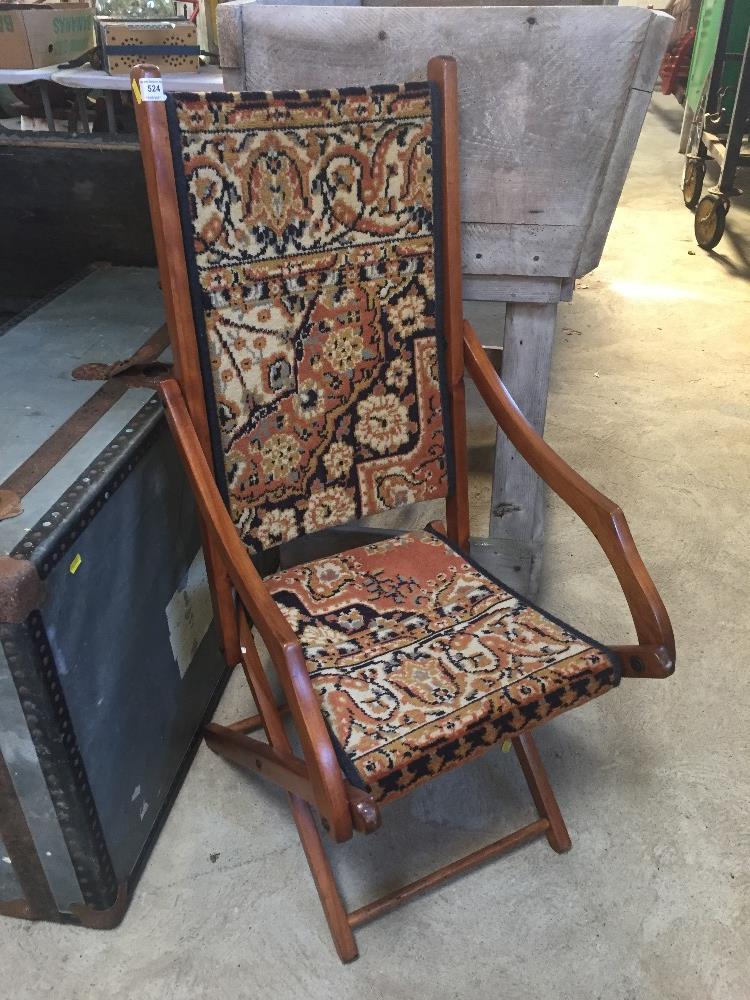 An Edwardian carpet upholstered folding salon chair