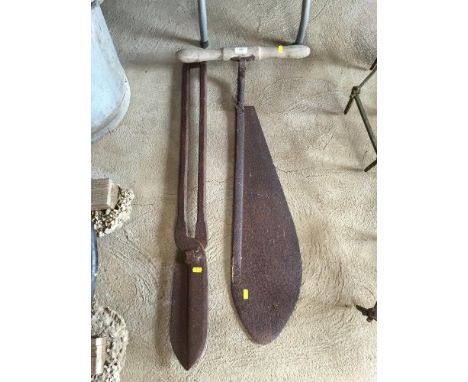 A Vintage hay knife and a large pair of metal cutters