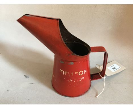 A Thelson tractor oil filler can