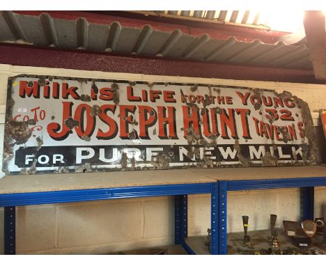 An enamel shop sign for Joseph Hunt, Tavern Street, "Milk is Life for the young", (approx. 52cm x 180cm)