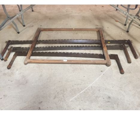 Four vintage cross-cut saws