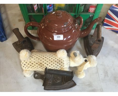 A large enamel teapot; three flat irons etc.