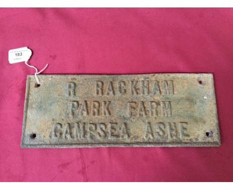 A cast iron plaque for "R. Rackham, Park Farm, Campsea Ashe"
