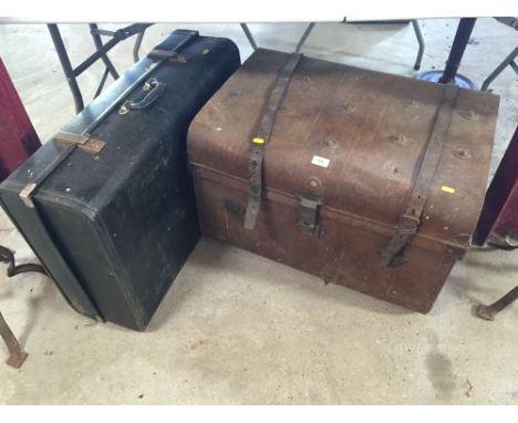 An old metal tin trunk; and a suitcase