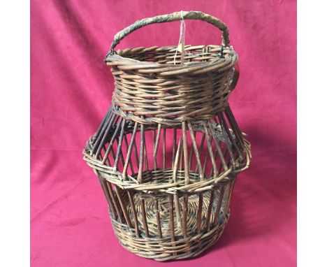 A Vintage wicker egg collecting basket; and "Spillers" calf food enamel measure