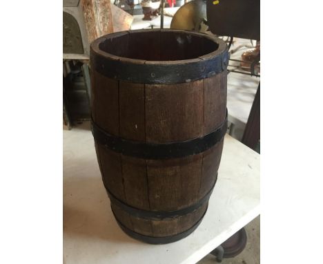 A wooden barrel stick stand