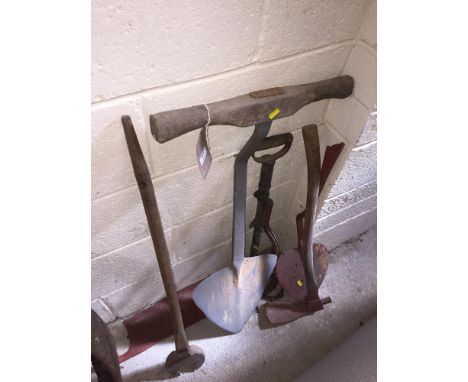 A quantity of old tools including turf spades, large spanner, pump etc.