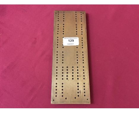 A brass cribbage board