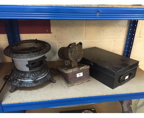 A Vintage bee keepers smoker; a small enamel and cast iron stove; and a tin moneybox