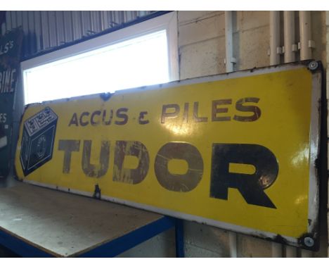 A Tudor Batteries enamel advertising sign, (approx. 154cm x 43cm)