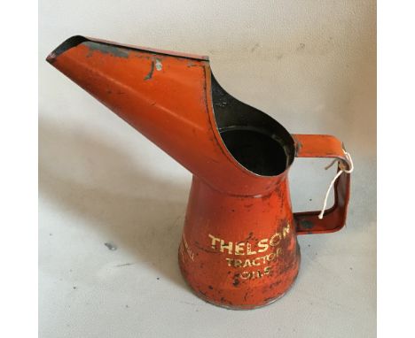 A large Thelson tractor oil filler can