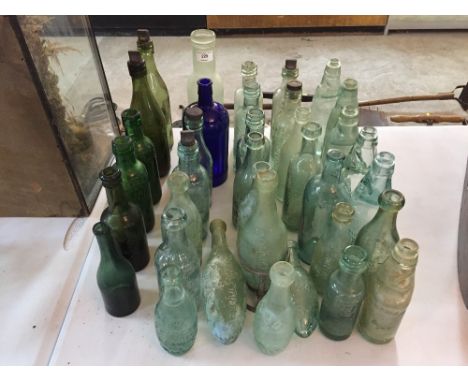 A collection of various Vintage glass, lemonade, beer and other bottles, many local examples