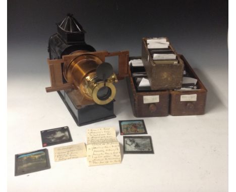 A Lontio magic lantern, 17in (43.2cm) long, 6in lens, adapted for electricity, with three boxes glass slides, topograsphical,