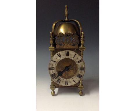 An early 20th century brass 'lantern clock' mantel timepiece, of small proportions and in the 17th century taste, 10cm silver