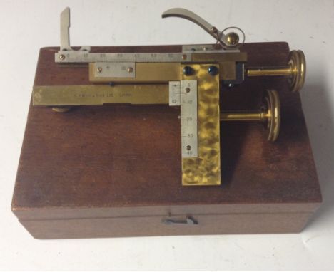 A laboratory measuring accessory, by W Watson & Sons Ltd, London, brass frame, steel calipers and scales, rack and pinion adj