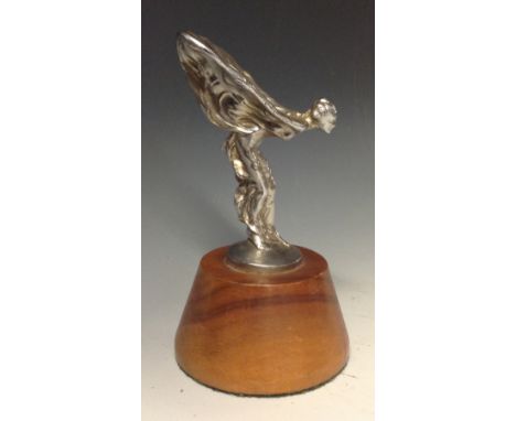 Rolls Royce - after Charles Sykes (1875-1950), a car mascot, Spirit of Ecstasy, mounted on a conical treen stand, 15.5cm high