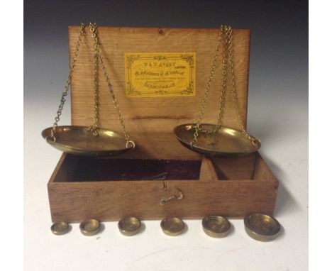 A pair of 19th century brass and steel travelling beam scales, by W & T Avery, Birmingham, six graduated troy oz cup weights,