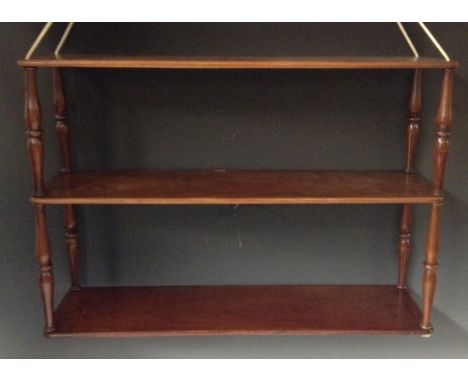 A Victorian Campaign mahogany three-tier collapsible hanging book shelf, strung and threaded superstructure, turned supports,