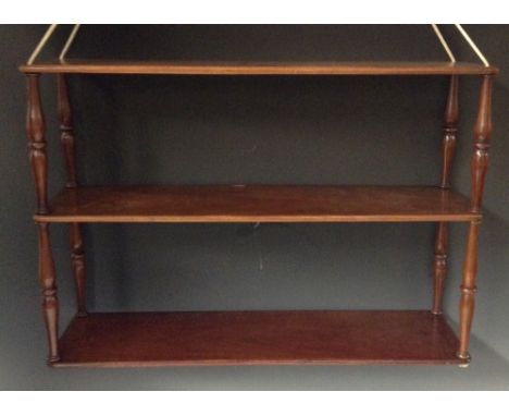 A Victorian Campaign mahogany three-tier collapsible hanging book shelf, strung and threaded superstructure, turned supports,