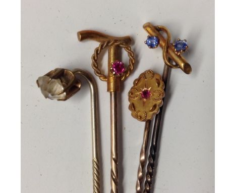 An Edwardian 15ct gold novelty riding crop stick pin, marked, 1.7g gross; an Edwardian 9ct gold and silver stick pin, marked,