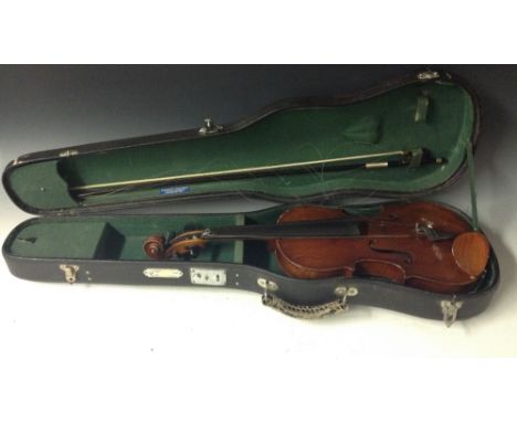 A violin, the two-piece back 33.5cm long excluding button, paper Stradivarius label, ebony tuning pegs, 56cm long overall, ea