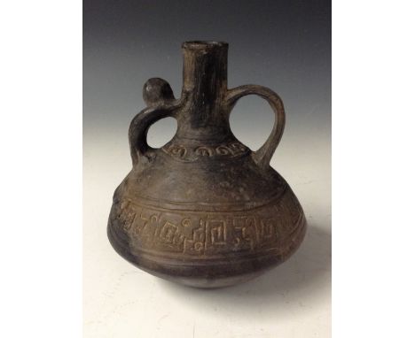 Antiquities - a Peruvian Inca black pottery compressed ovoid drinking vessel, scroll handles to shoulders, 16cm high, probabl