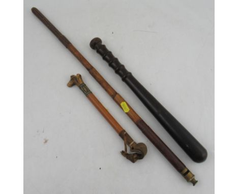 A turned wooden truncheon, together with a small carved stag dog whistle crop and another whistle mounted bamboo stick&nbsp;