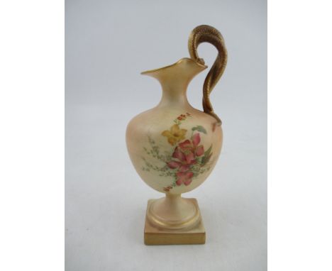 A Royal Worcester blush ivory ewer, on a pedestal, decorated with flowers to entwined serpent handles, Shape No 1968, height 