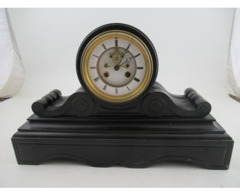 A Victorian black slate mantel clock, with striking movement