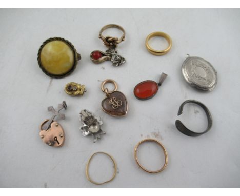 Two gold wedding bands, a gold intertwined ring, a heart shaped locket dated 1901 and various other jewellery&nbsp;