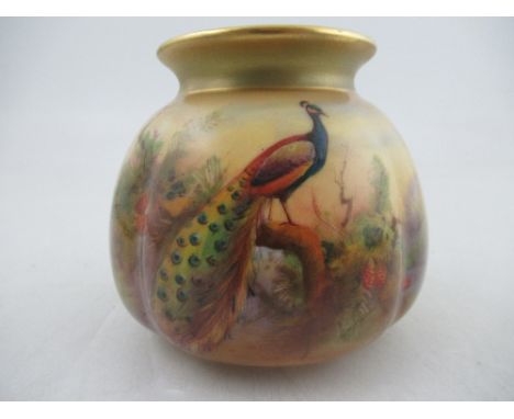 A Royal Worcester quarter lobed squat vase, decorated with a peacock in a landscape, signed W. Austin,&nbsp; shape No H135, h