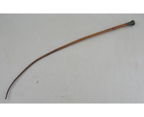 A rhino hide riding whip, with silver coloured end - please note an export license may not be granted for this item