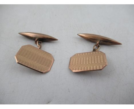 A pair of 9ct Rose gold torpedo cuff links with engine turned hexagonal terminals&nbsp;