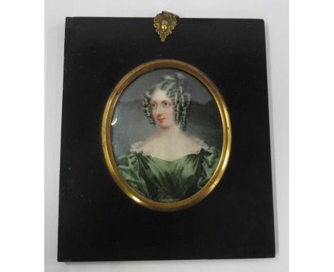 An oval portrait miniature, of a Regency lady in green dress, diameter 3.5ins Condition Report:   Not able to remover item fr