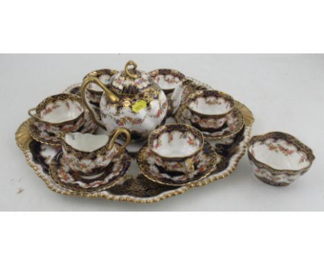 A Staffordshire China cabaret set, comprising tray, tea pot, sugar bowl, jug, six saucers and five cupsCondition Report:  All