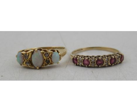 An 18ct opal three stone ring, highlighted with diamonds, together with a 9ct five stone ruby ring highlighted with diamonds