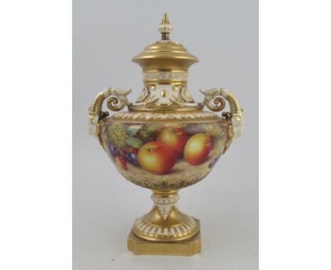 A Royal Worcester covered pedestal vase, decorated all round with fruit to a mossy background by Freeman, shape number 1572, 