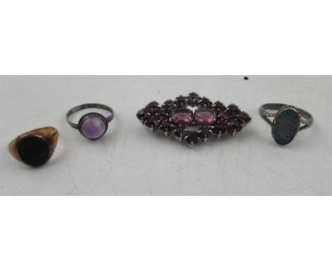 A signet ring, together with two other rings and a brooch