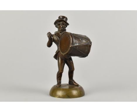 A Bronze Figure of a Busker with Drum, Pipes and Cymbals, 10.5cms High (Loss to Drum Stick)