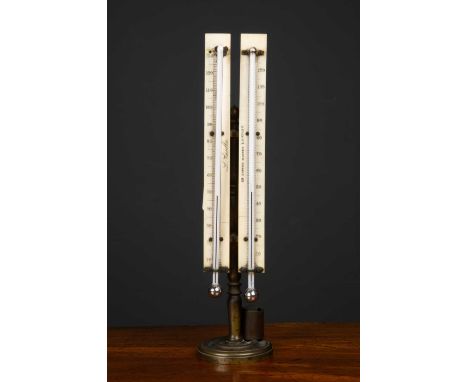 A Victorian double desk thermometer by L Casella, 23 Hatton Garden London, with ivory back boards on brass stand, 6cm diamete