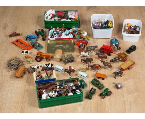 A collection of Britains die-cast lead farm animals to include cattle, horses, figures, farm machinery, trailers and other ac