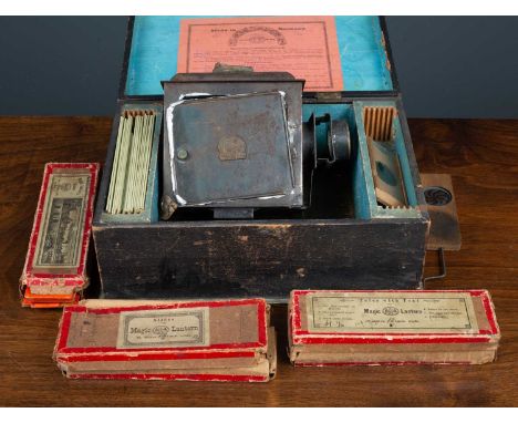 A magic lantern projector in original case with three boxes of glass slides,Condition report: Projector not tested but with d