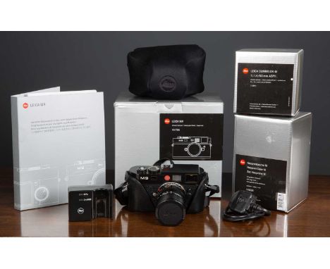 A Leica M9 Digital Rangefinder Camera in black, serial number 3810895 with its original box and instruction manual, together 