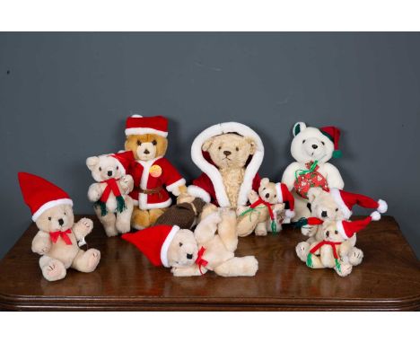 A Steiff Nikolaus bear in Father Christmas outfit, 30cm high, a Steiff Original 'Baby Santa' bear, 26cm high, together with s