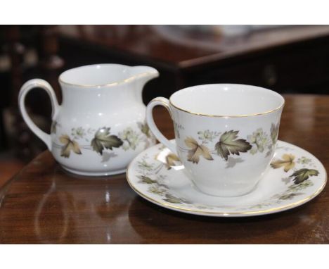 ROYAL DOULTON LARCHMONT TEA SERVICEincluding twelve cups, twelve saucers, twelve side plates, cream sugar, teapot and two cak