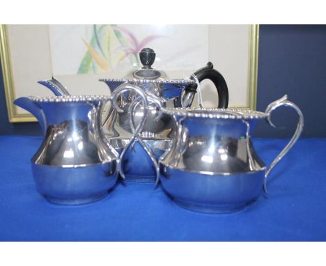 LOT OF SILVER PLATED ITEMSincluding a beaded three piece tea service, a three piece cruet set, loose flatware etc.