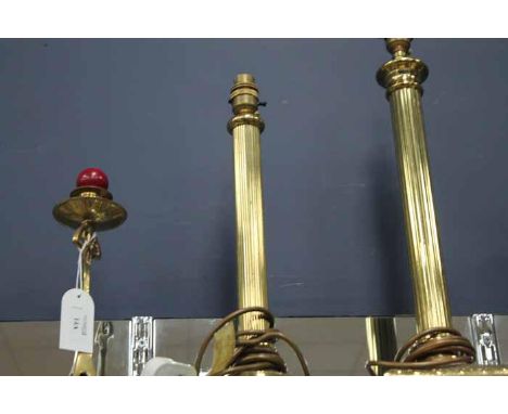 LOT OF FOUR BRASS COLUMN LAMP BASEStogether with two metal candlesticks (6)