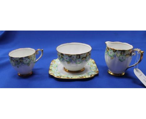 EARLY 20TH CENTURY ENGLISH BELL CHINA FLORAL GILT TEA SETin yellow and green florals with gilt borders,twelve cups (one chipp